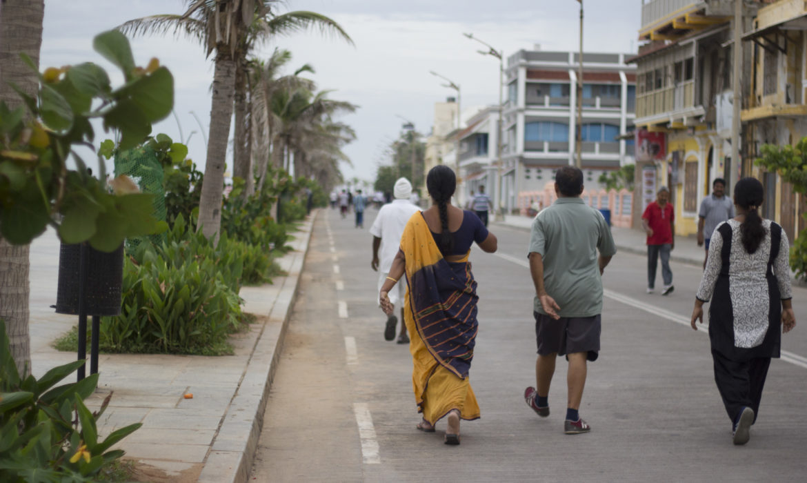 people walking on promenade beach in pondicherry