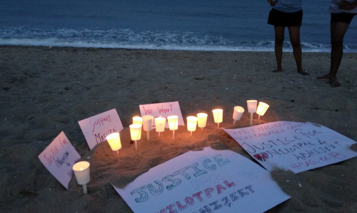 candlelight vigil on serenity beach for victims of mob lynching in assam