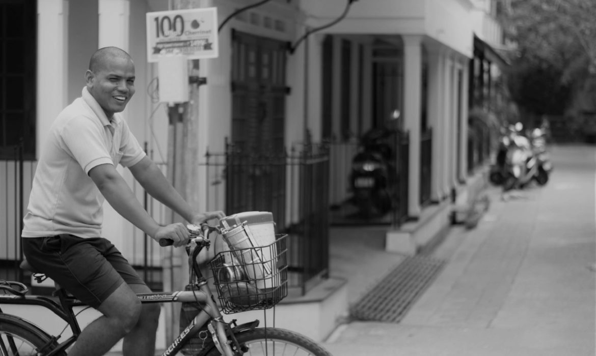 MAN CYCLING IN PONDICHERRY FRENCH TOWN