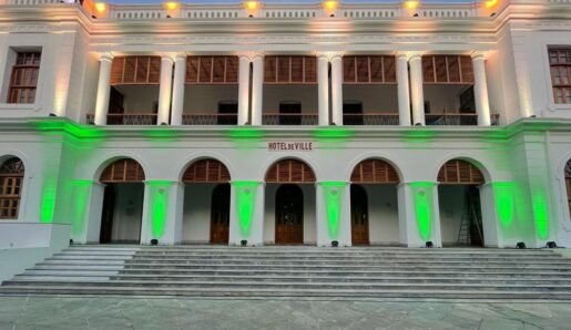 Marie among the buildings illuminated for independence day long weekend in Pondicherry